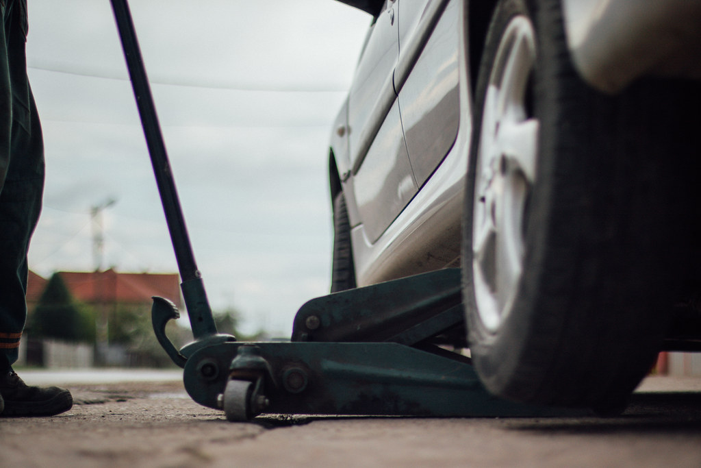 Professional mechanic with specialized automotive service tools